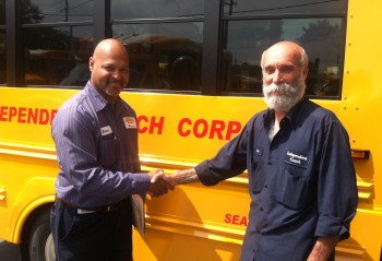 Mr. Joe Lansone (right), maintenance director for Independent Coach Corporation, takes delivery of the first Trans Tech bus from Robert Garcia the service manager at the Leonard Bus Sales Garden City Park location.