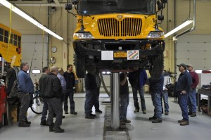Technicians and school officials from across capital region visit one of many training stations at Leonard Bus Sales facility. 