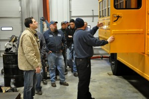 Technicians and school officials from across capital region visit one of many training stations at Leonard Bus Sales facility.